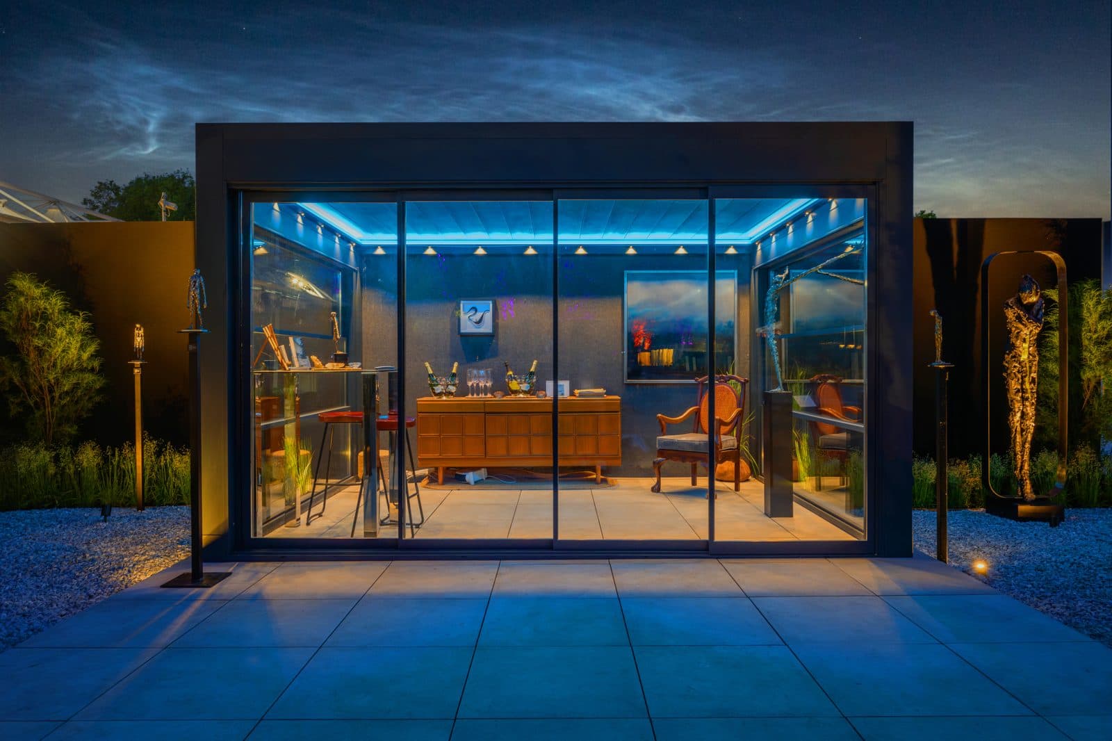 Bioclimatic pergola with blue ambient lighting