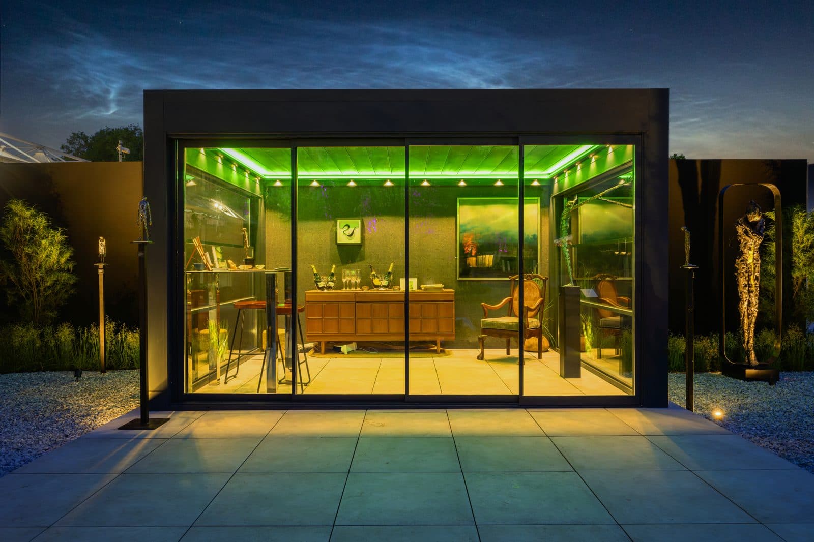 Bioclimatic pergola with green ambient lighting